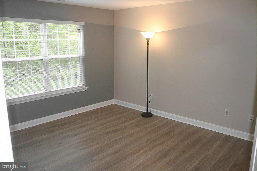 1603 Squirrel Road Marlton, NJ 08053 - Photo 13 of 29 a view of an empty room with wooden floor and a window