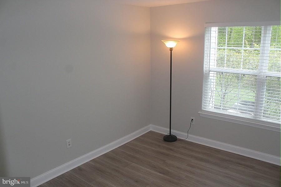 1603 Squirrel Road Marlton, NJ 08053 - Photo 14 of 29 an empty room with wooden floor and windows
