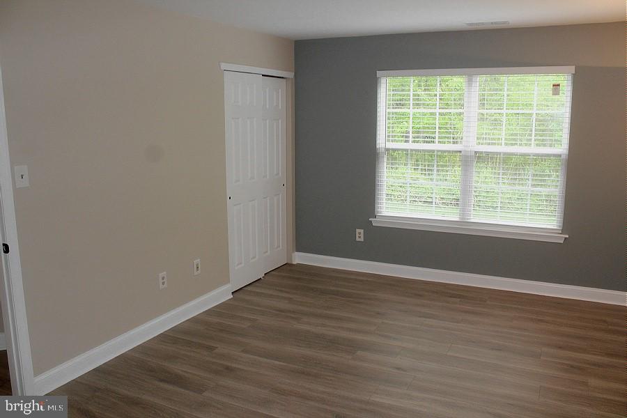 1603 Squirrel Road Marlton, NJ 08053 - Photo 17 of 29 an empty room with wooden floor and windows