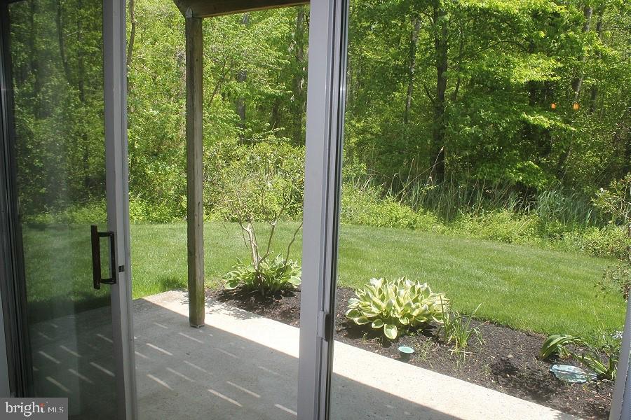 1603 Squirrel Road Marlton, NJ 08053 - Photo 24 of 29 a view of a glass door and a yard