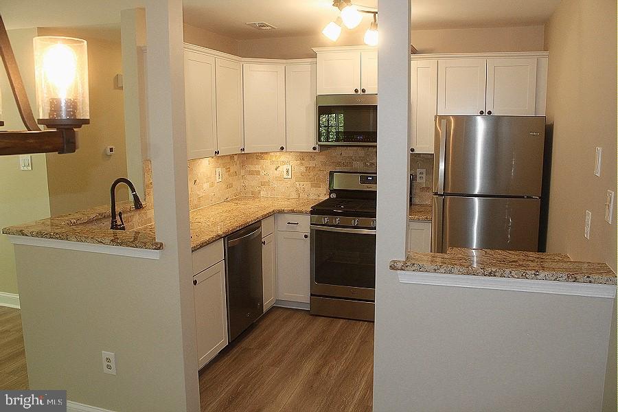 1603 Squirrel Road Marlton, NJ 08053 - Photo 6 of 29 a kitchen with a refrigerator sink and stove