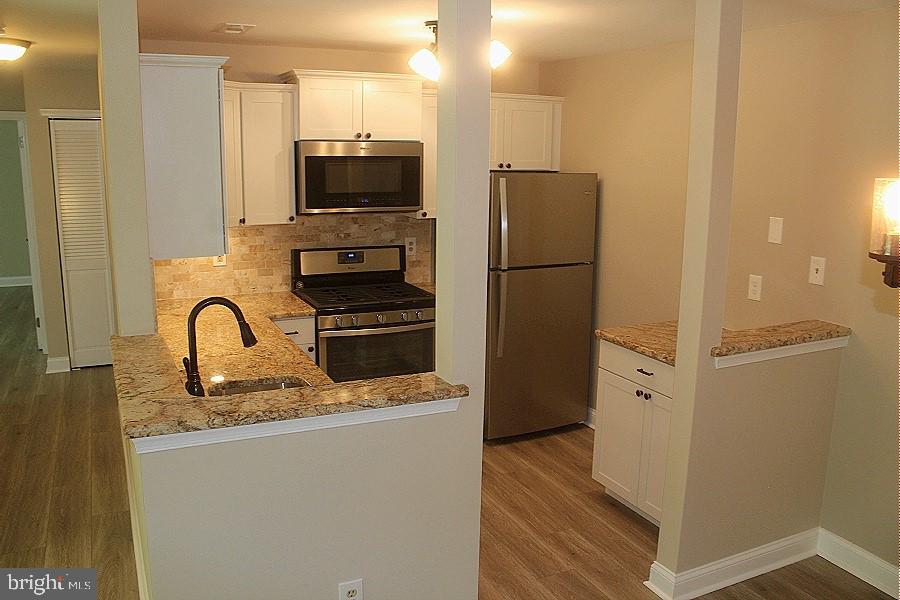 1603 Squirrel Road Marlton, NJ 08053 - Photo 7 of 29 a kitchen with stainless steel appliances granite countertop a refrigerator and a sink