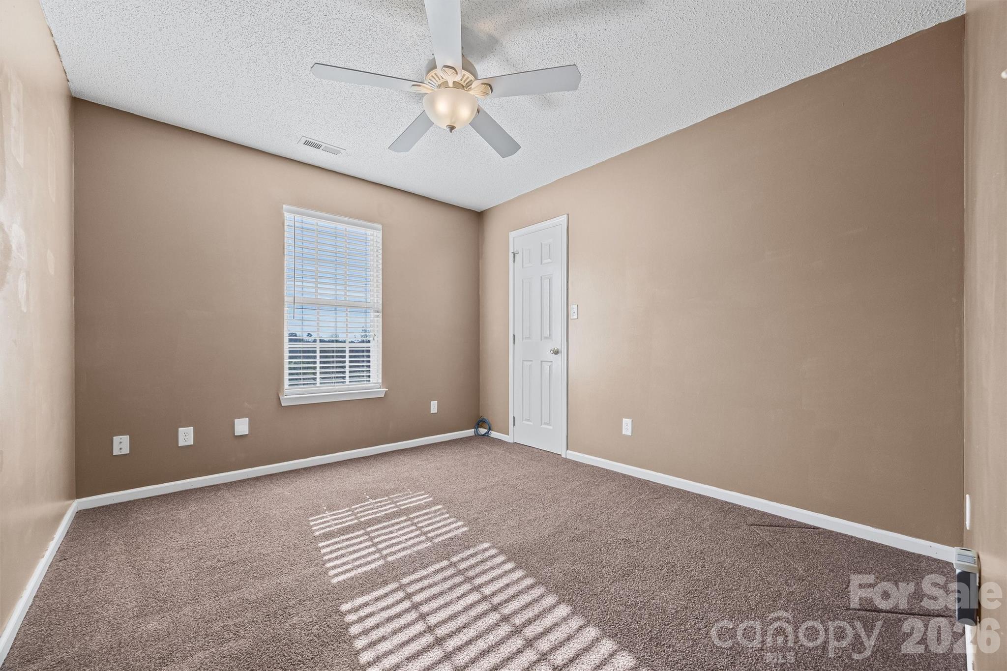 132 Sella Ridge Drive Mount Holly, NC 28120 - Photo 18 of 28 a view of an empty room with a window