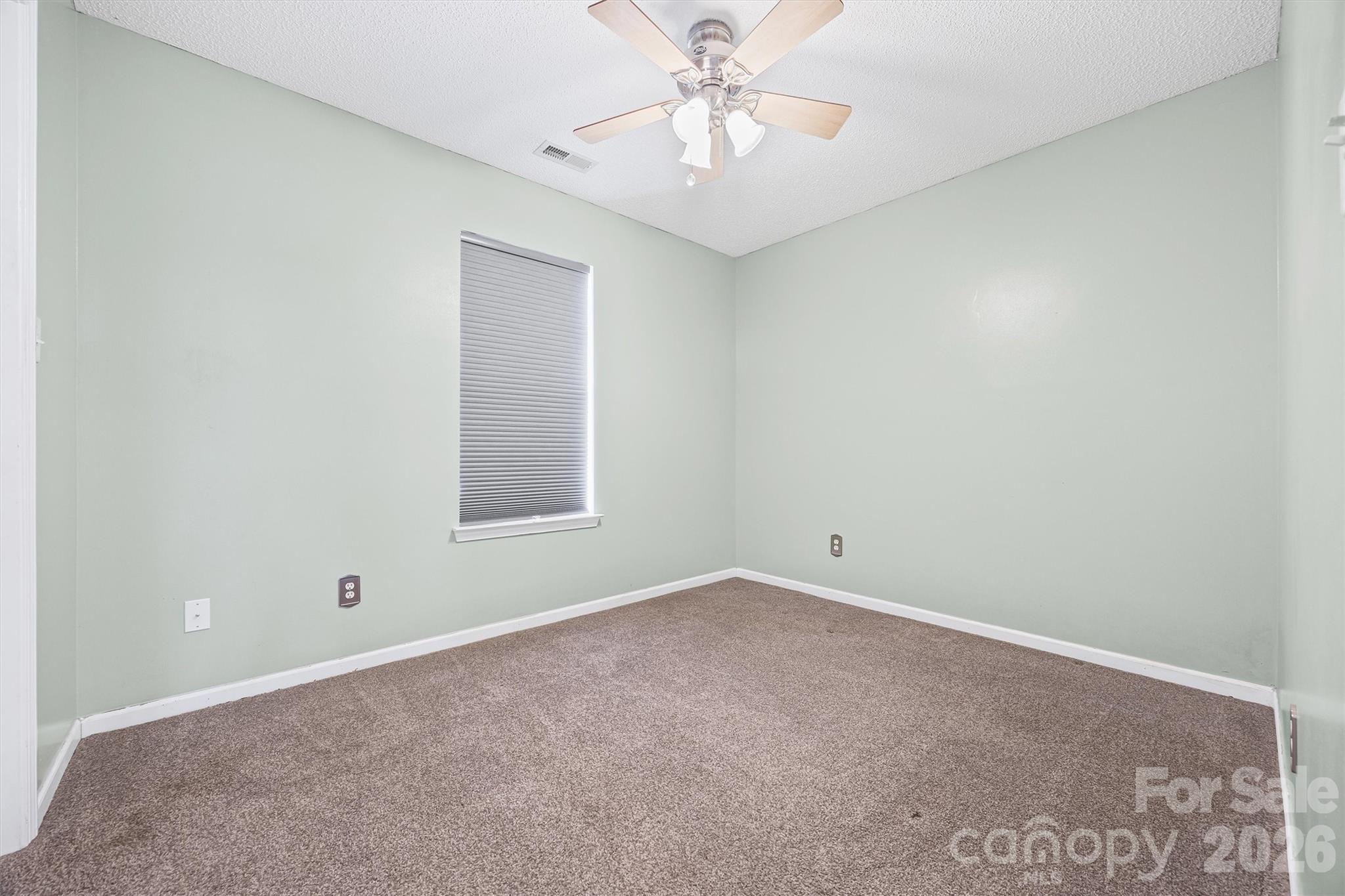 132 Sella Ridge Drive Mount Holly, NC 28120 - Photo 20 of 28 a view of an empty room with a window