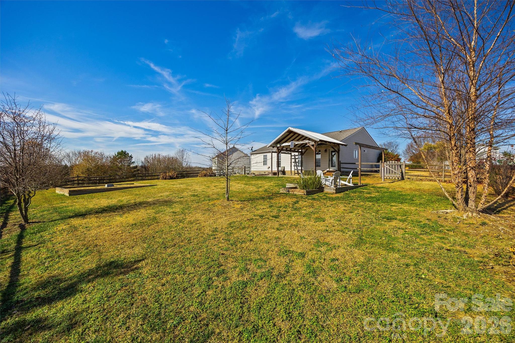 132 Sella Ridge Drive Mount Holly, NC 28120 - Photo 25 of 28 a view of a lake with a house in the background