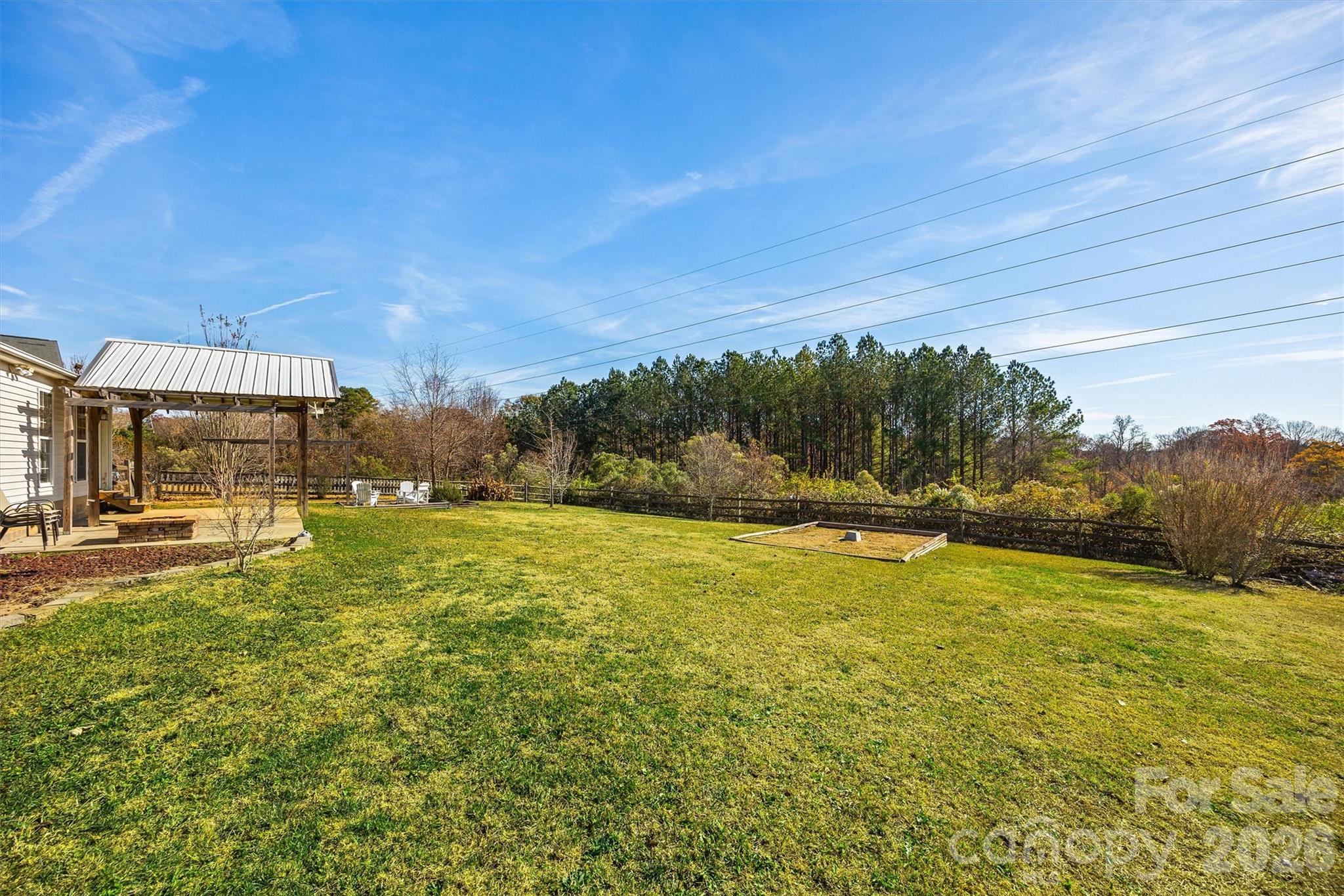 132 Sella Ridge Drive Mount Holly, NC 28120 - Photo 27 of 28 a view of a large pool with an outdoor space and seating area
