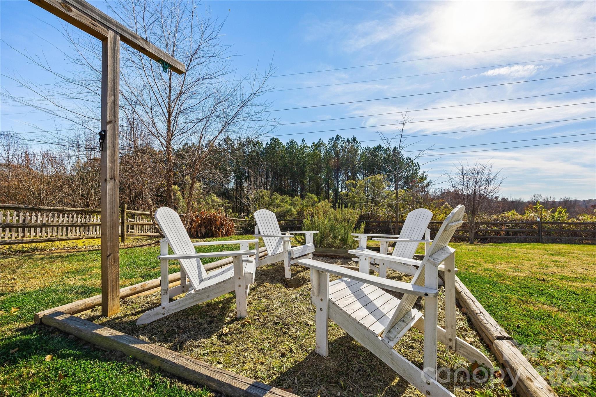132 Sella Ridge Drive Mount Holly, NC 28120 - Photo 28 of 28 a view of a chair and tables in the patio next to a yard