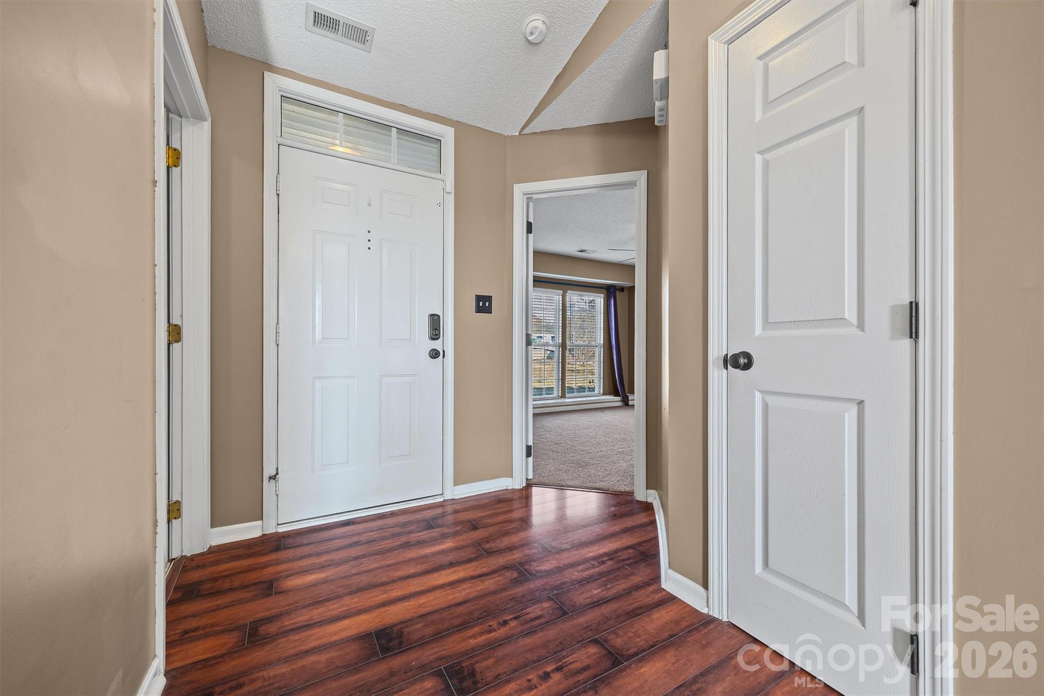 132 Sella Ridge Drive Mount Holly, NC 28120 - Photo 5 of 28 a view of a hallway with wooden floor