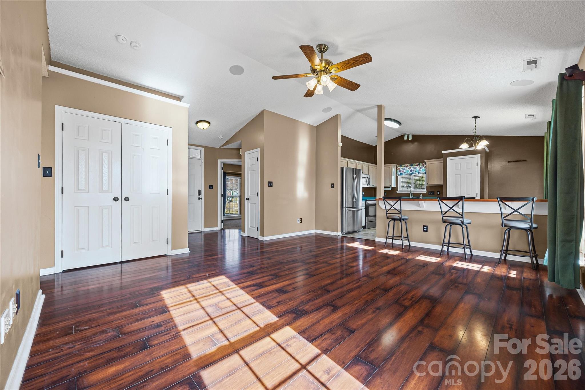 132 Sella Ridge Drive Mount Holly, NC 28120 - Photo 7 of 28 a living room with furniture and wooden floor