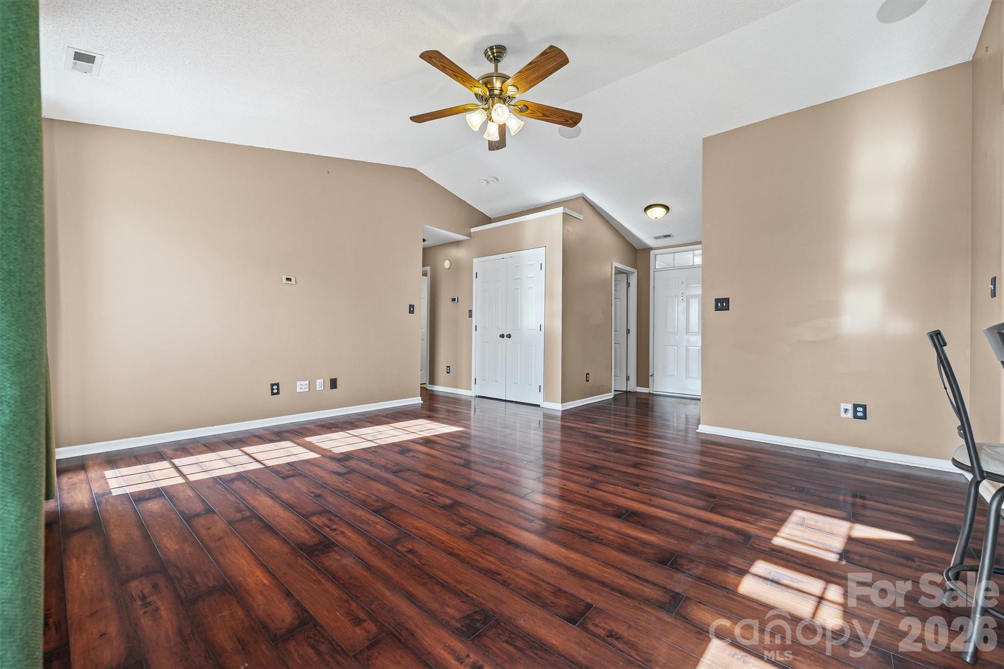 132 Sella Ridge Drive Mount Holly, NC 28120 - Photo 9 of 28 a view of an empty room with wooden floor