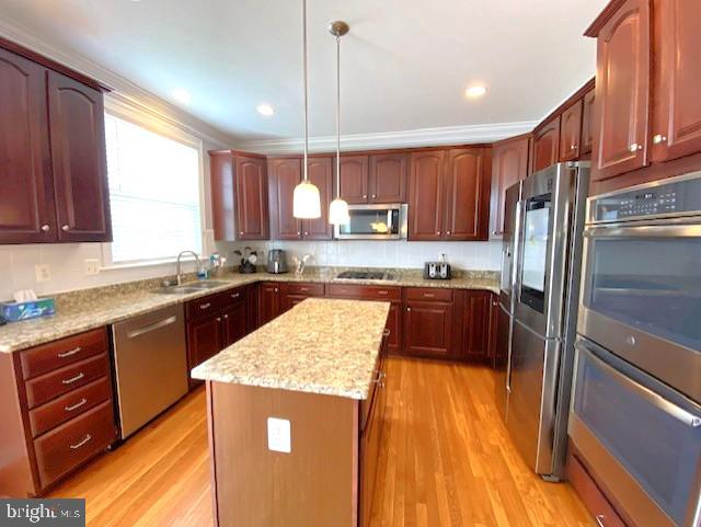 320 Kennard Road Perkasie, PA 18944 - Photo 8 of 29 a kitchen with stainless steel appliances granite countertop a refrigerator a sink dishwasher a stove and white countertops with wooden floor
