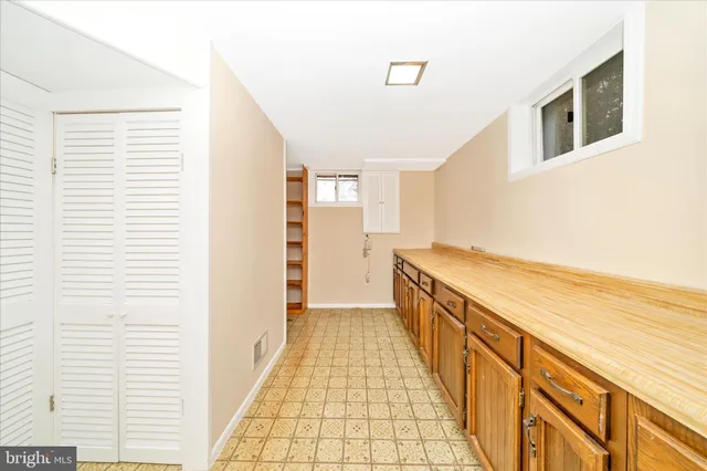 a view of a kitchen with refrigerator and washer