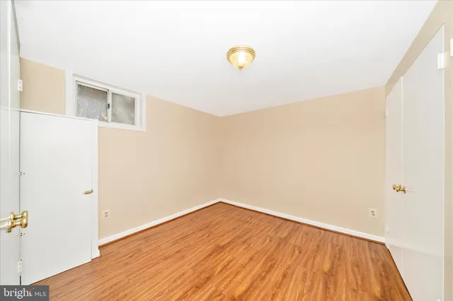 a view of a roof deck with wooden floor and fence