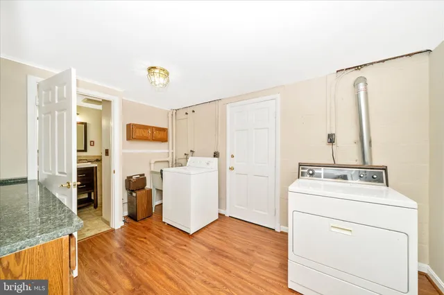 a view of a balcony with wooden floor and fence
