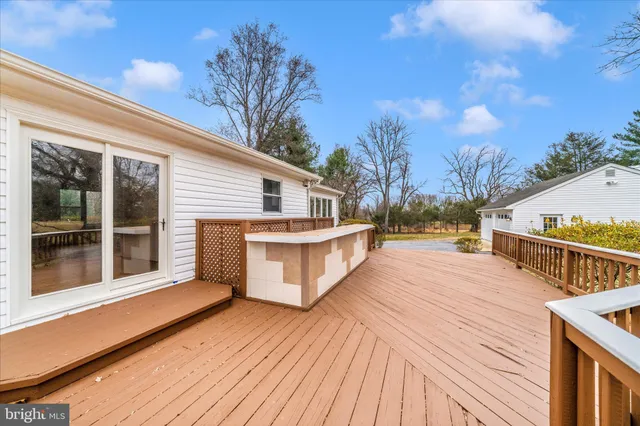 a view of a house with a large tree