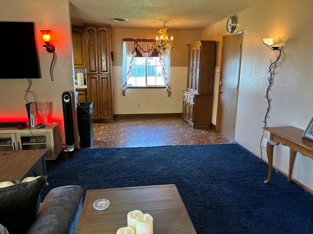 a bedroom with a bed and a mirror