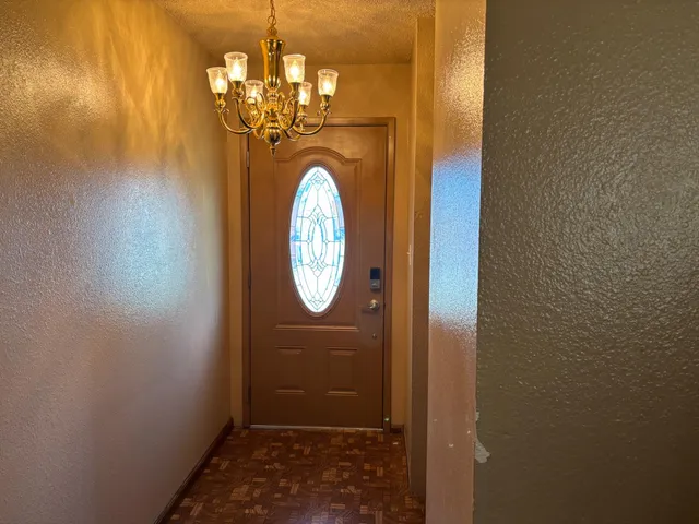 a bedroom with a bed and flat screen tv