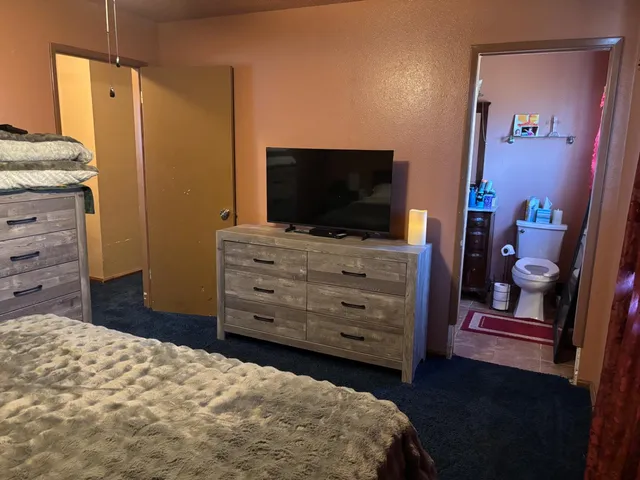 a view of a room with a wooden floor and a window