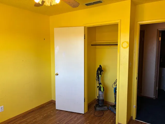 a view of a backyard with potted plants