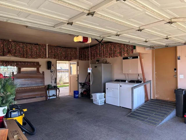 a view of a house with backyard and garden