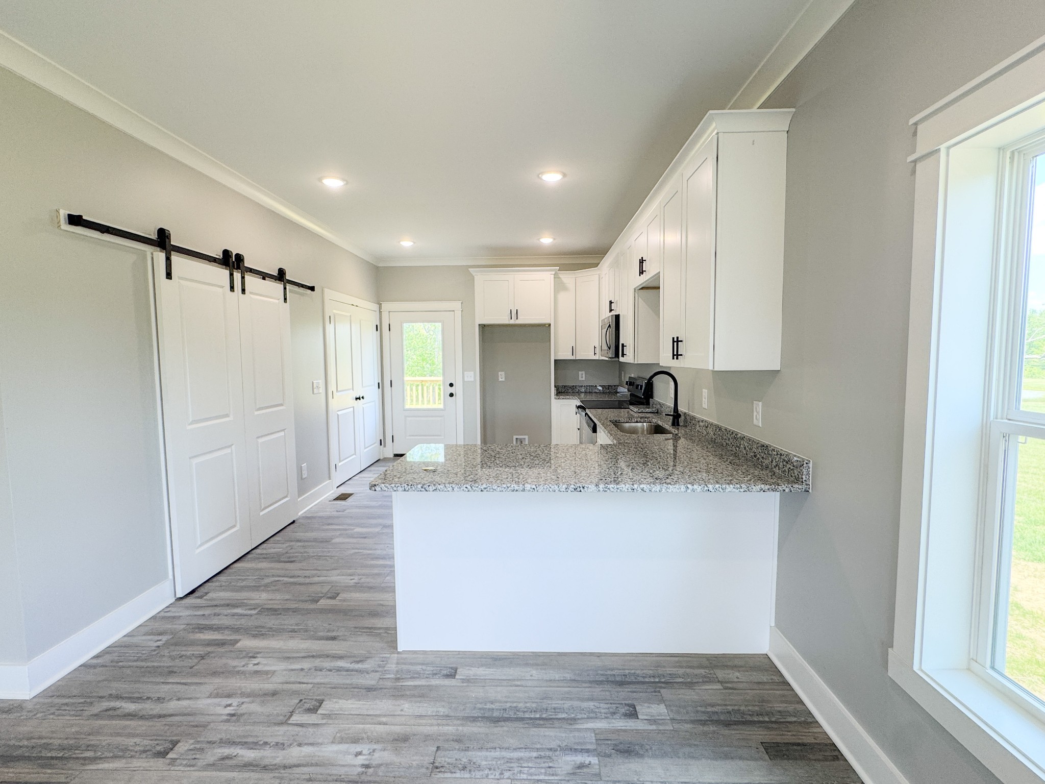 181 Rock House Hollow Road Bethpage, TN 37022 - Photo 19 of 51 a view of a kitchen with a sink and a refrigerator