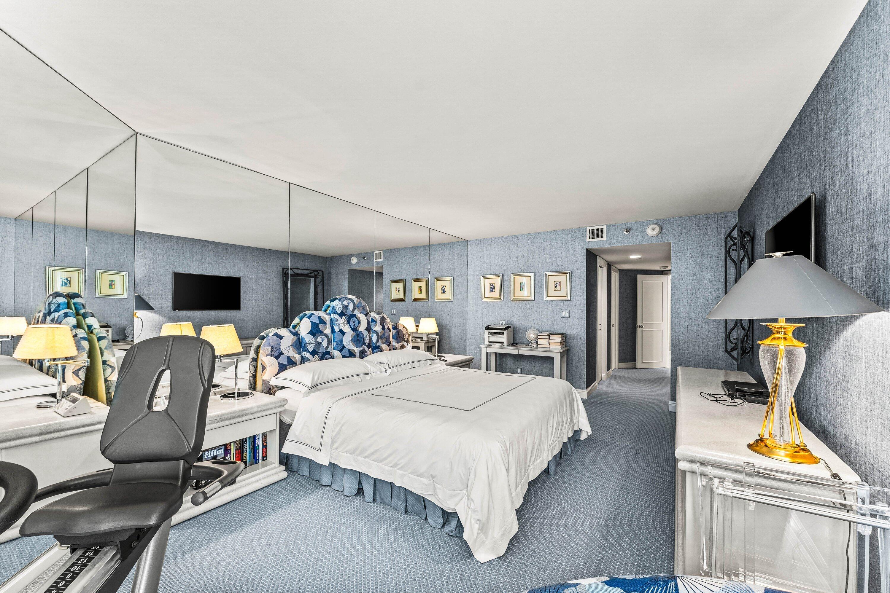 3170 South Ocean Boulevard, Unit S302 Palm Beach, FL 33480 - Photo 13 of 34 a bedroom with a bed large window and couch