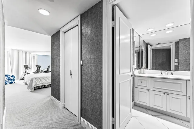 a bedroom with two beds and painted walls