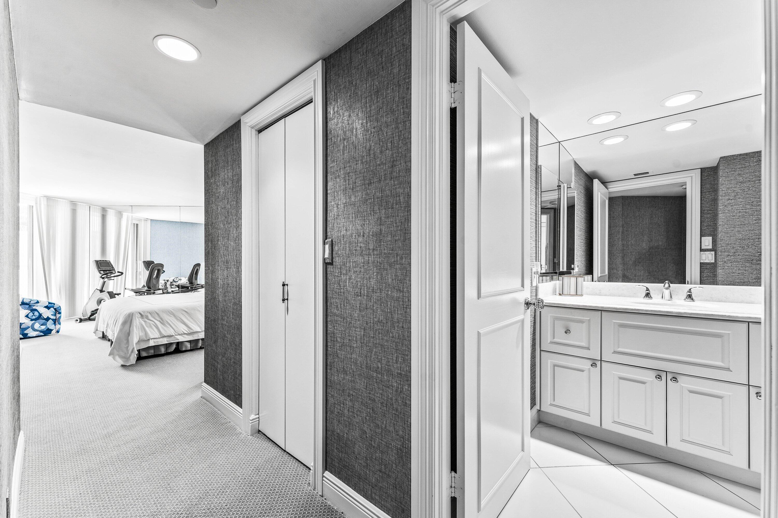 3170 South Ocean Boulevard, Unit S302 Palm Beach, FL 33480 - Photo 14 of 34 a en suite bathroom with a double vanity sink and mirror