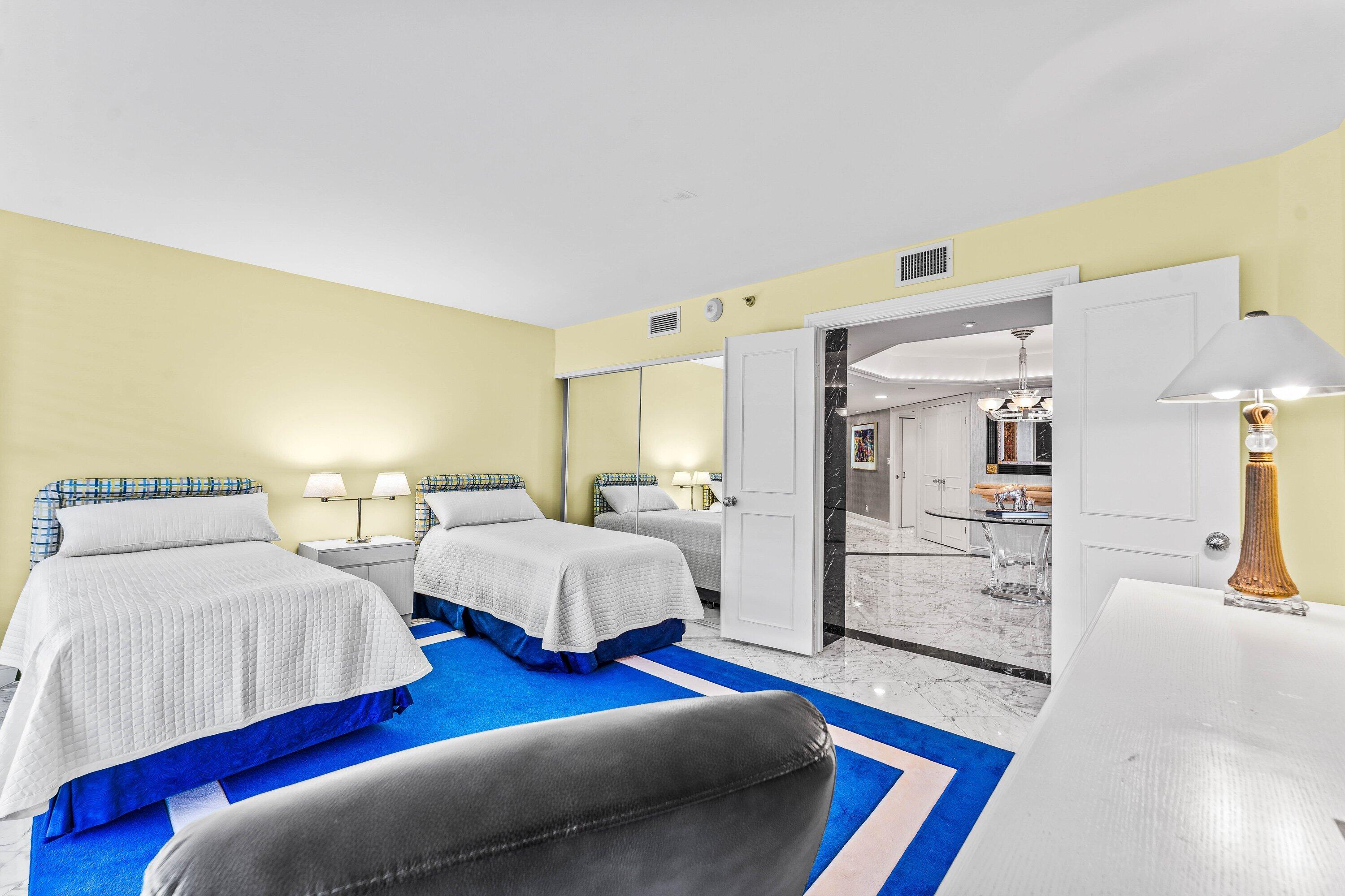 3170 South Ocean Boulevard, Unit S302 Palm Beach, FL 33480 - Photo 15 of 34 a bedroom with two beds and painted walls