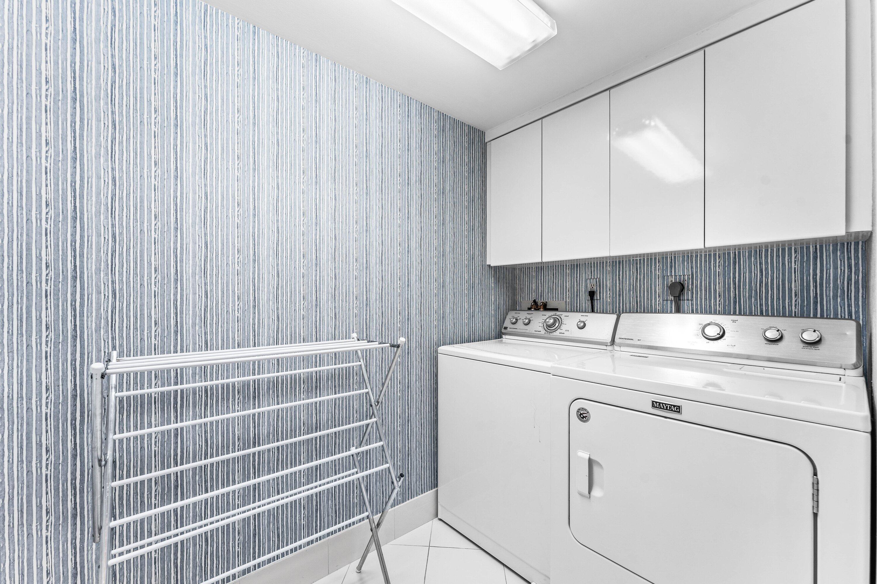 3170 South Ocean Boulevard, Unit S302 Palm Beach, FL 33480 - Photo 17 of 34 a view of storage and utility room with washer and dryer