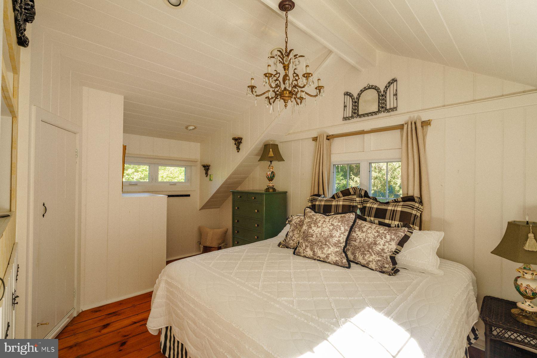 2943 Windy Bush Road Newtown, PA 18940 - Photo 21 of 49 a bedroom with a bed and wooden floor