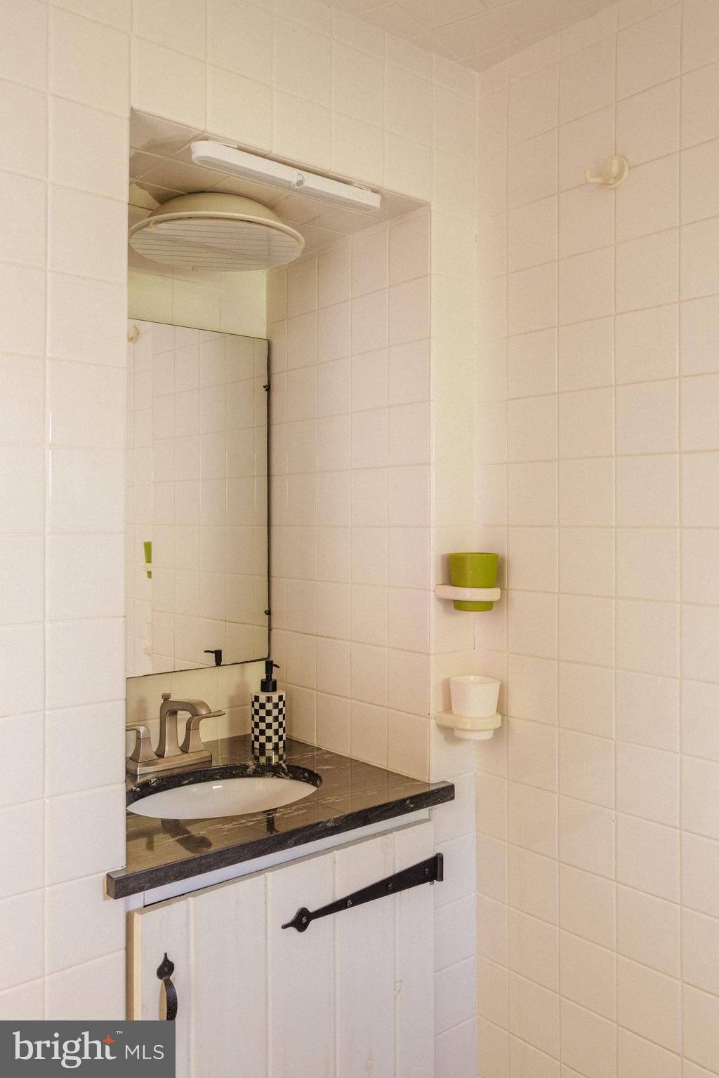 2943 Windy Bush Road Newtown, PA 18940 - Photo 23 of 49 a bathroom with a sink and a mirror