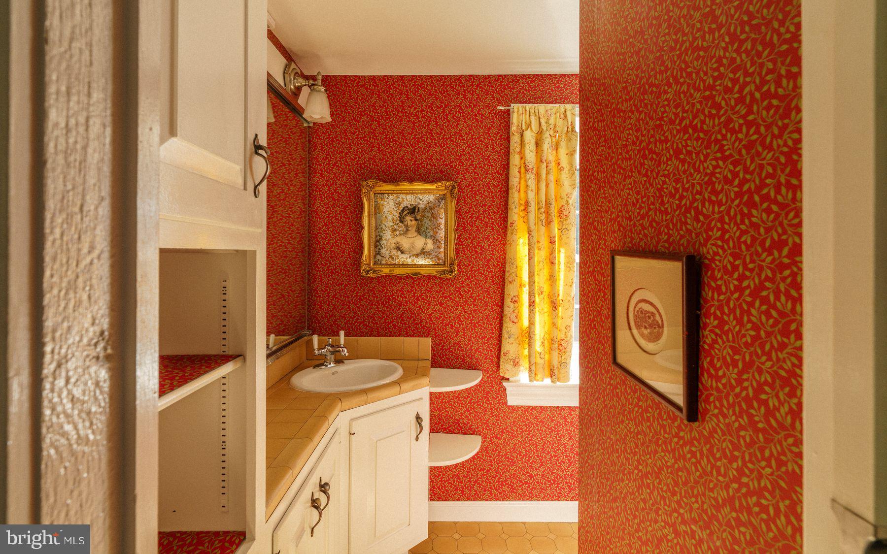 2943 Windy Bush Road Newtown, PA 18940 - Photo 28 of 49 a bathroom with a granite countertop sink and a mirror