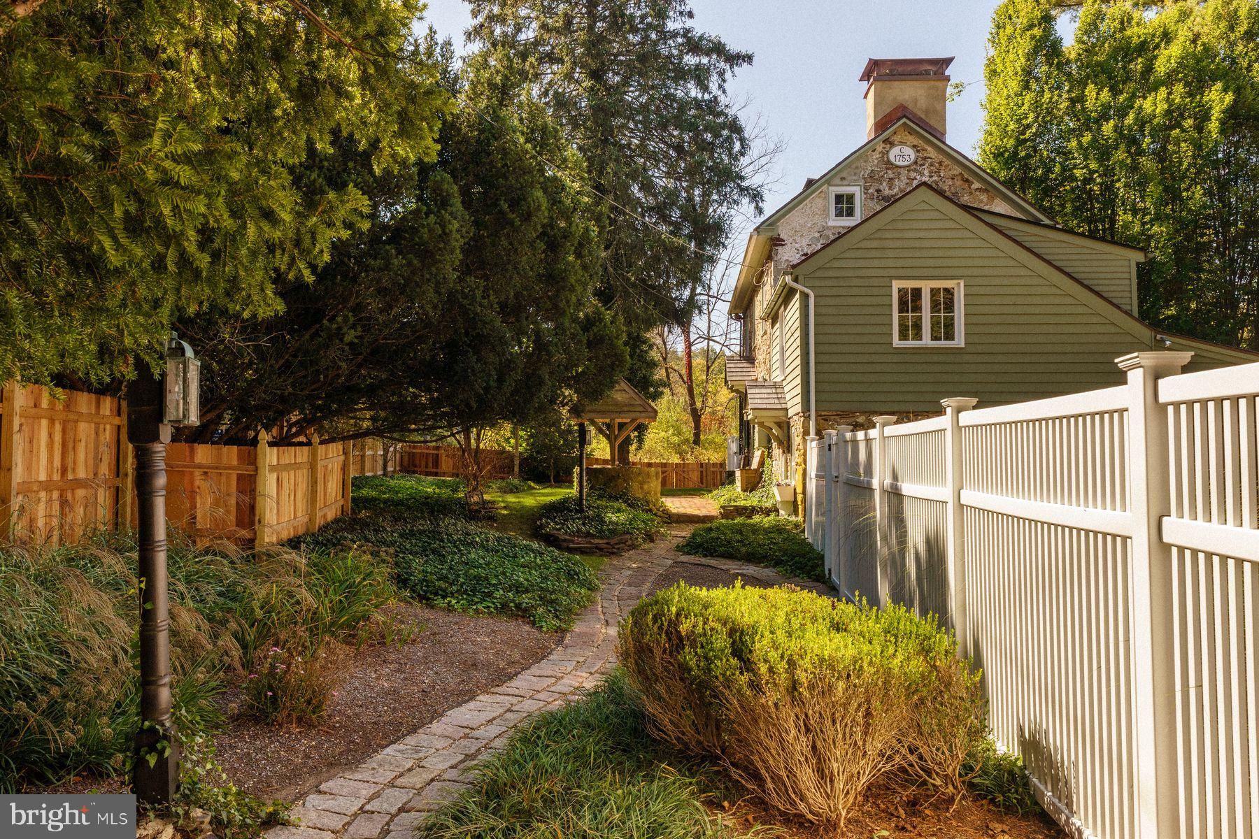2943 Windy Bush Road Newtown, PA 18940 - Photo 35 of 49 a front view of a house with garden