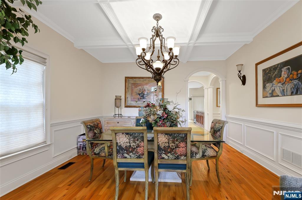 22 Meadowlake Drive Mahwah, NJ 07430 - Photo 8 of 39 a view of a dining room with furniture a chandelier and wooden floor