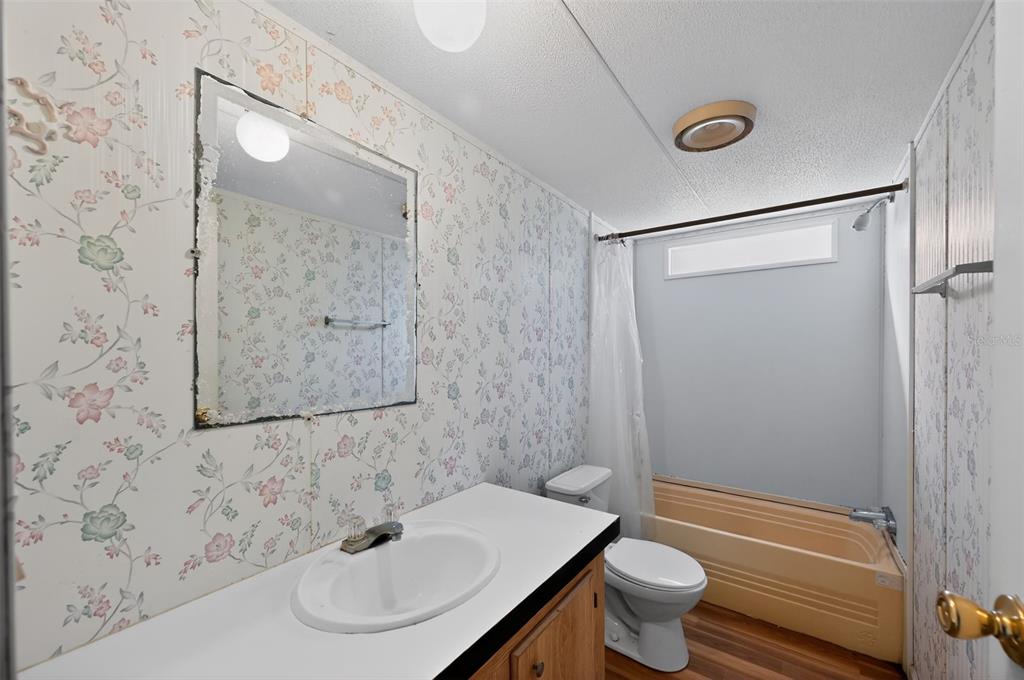 7405 Bonnie Lake Road Brooksville, FL 34601 - Photo 10 of 14 a bathroom with a sink toilet and shower