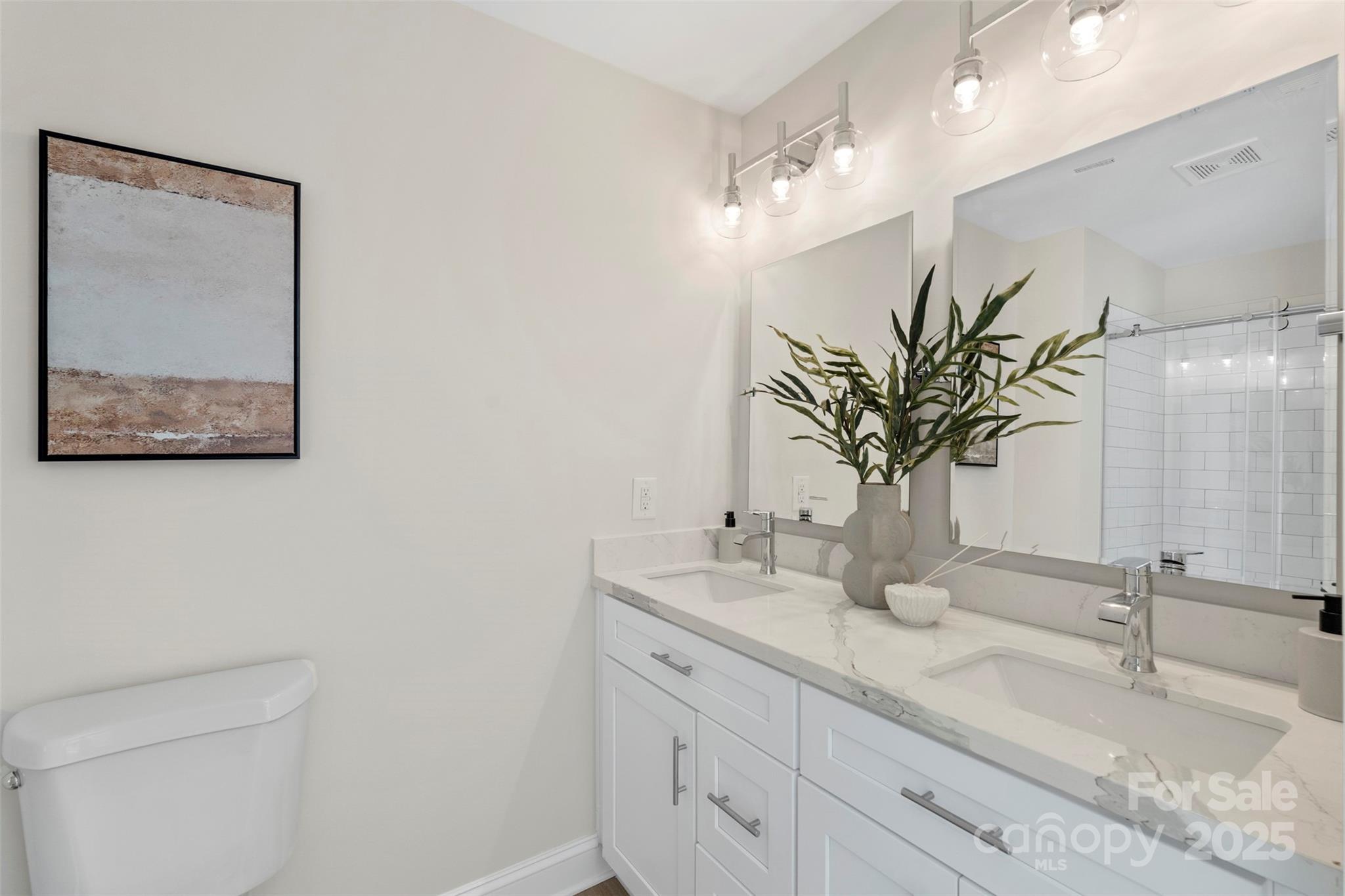 1116 Wonder Way Charlotte, NC 28208 - Photo 26 of 35 a bathroom with a double vanity sink and a mirror