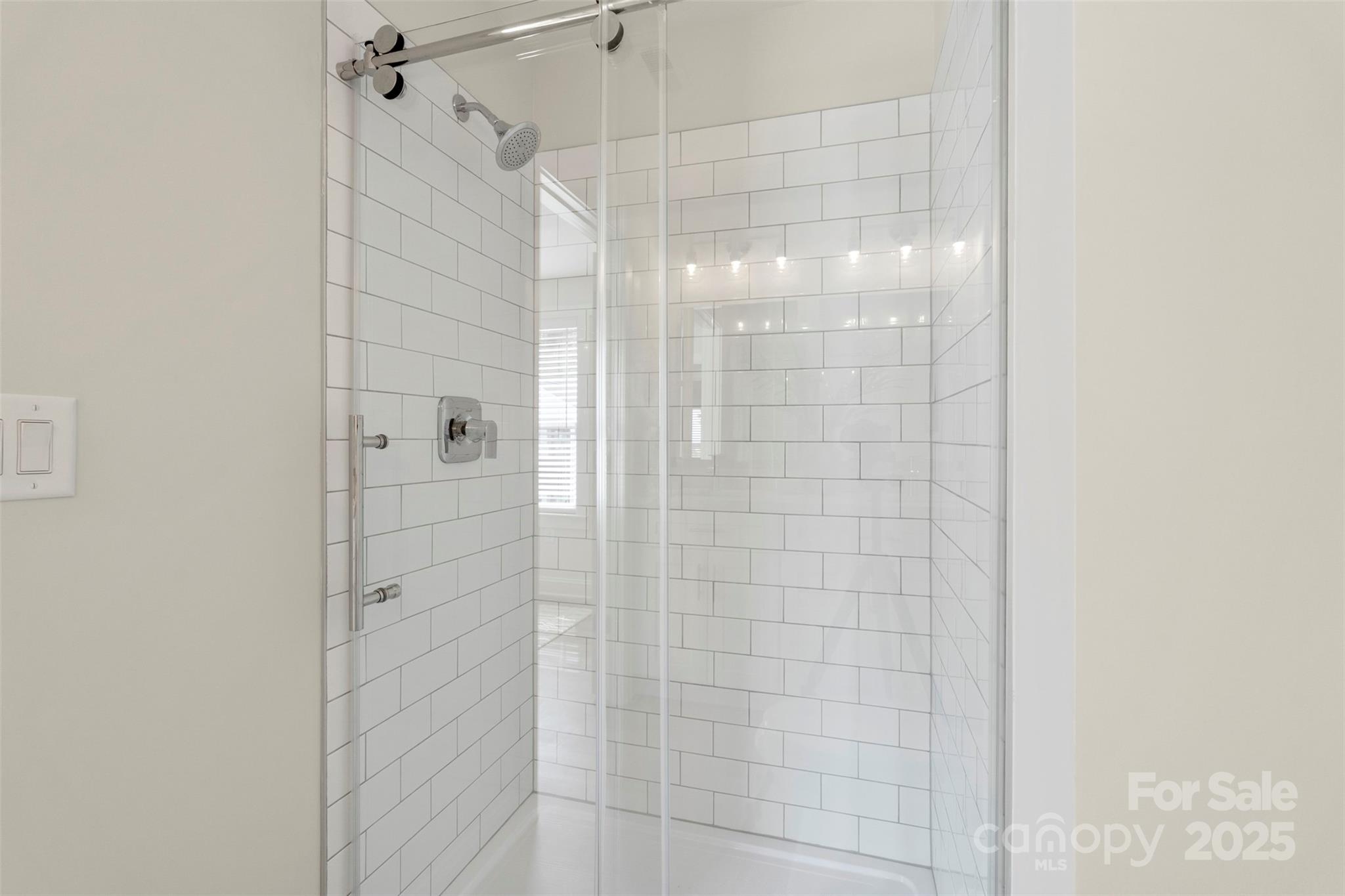 1116 Wonder Way Charlotte, NC 28208 - Photo 28 of 35 a bathroom with a glass shower door