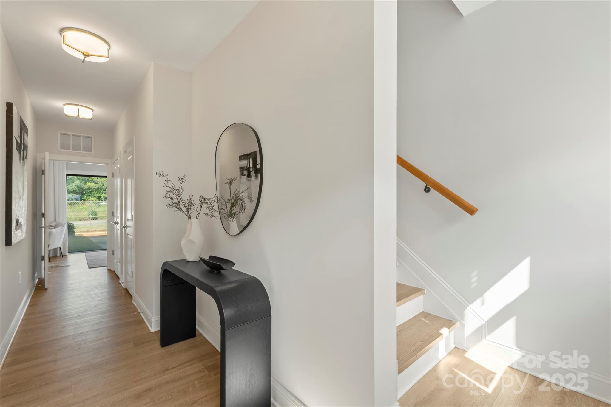 1116 Wonder Way Charlotte, NC 28208 - Photo 3 of 35 a view of a hallway with wooden floor