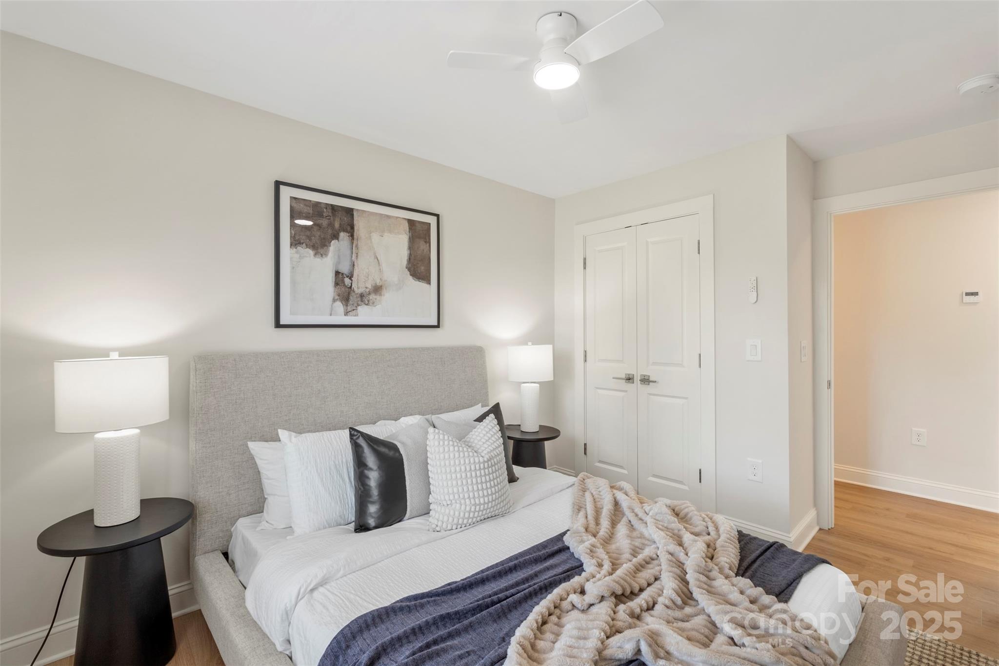 1116 Wonder Way Charlotte, NC 28208 - Photo 33 of 35 a bedroom with a bed and a lamp