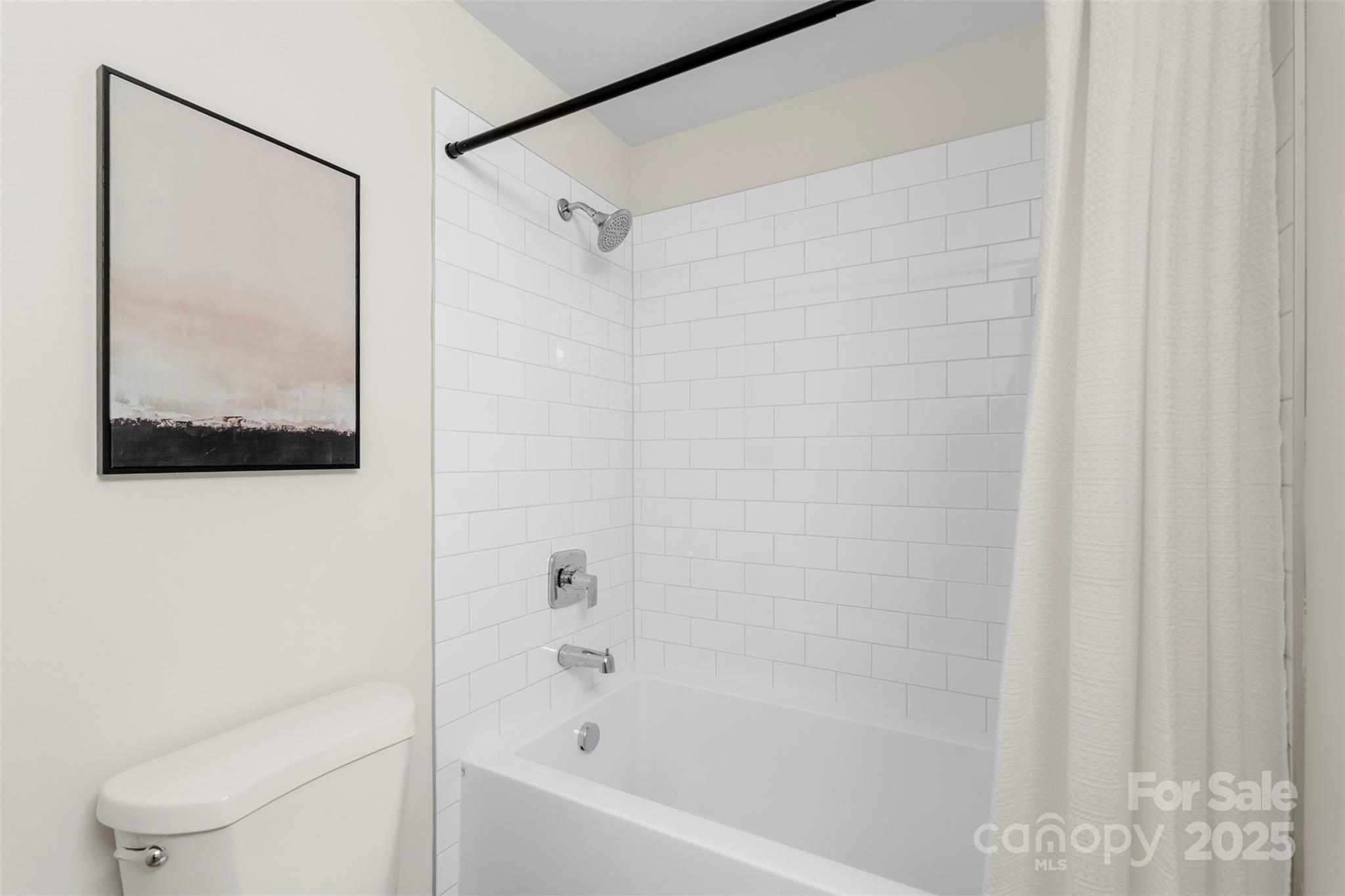 1116 Wonder Way Charlotte, NC 28208 - Photo 35 of 35 a bathroom with a bathtub and a shower