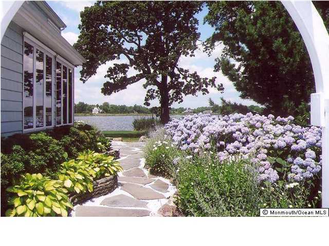 37 Goose Neck Point Road Oceanport, NJ 07757 - Photo 3 of 3 a view of a garden with a fountain