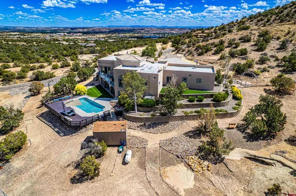 a view of a chairs and table in the patio