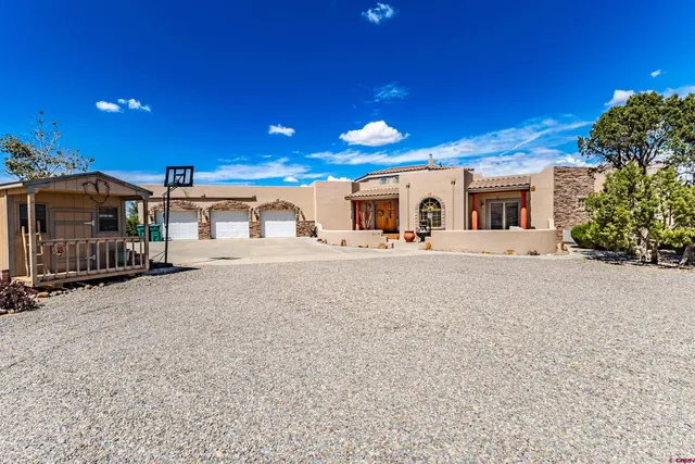 a large building with a large tree in front of it