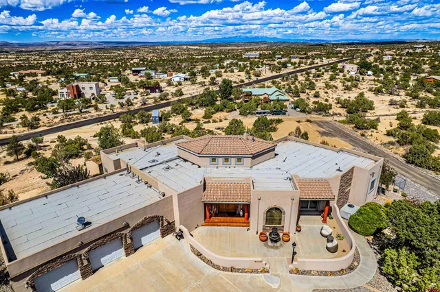 an aerial view of a house with a swimming pool