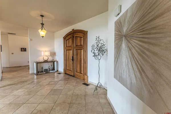 a view of a hallway view with staircase