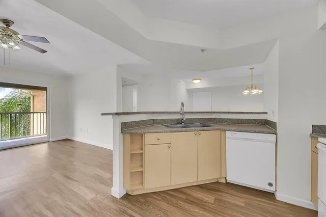 a view of a kitchen counter space and wooden floor