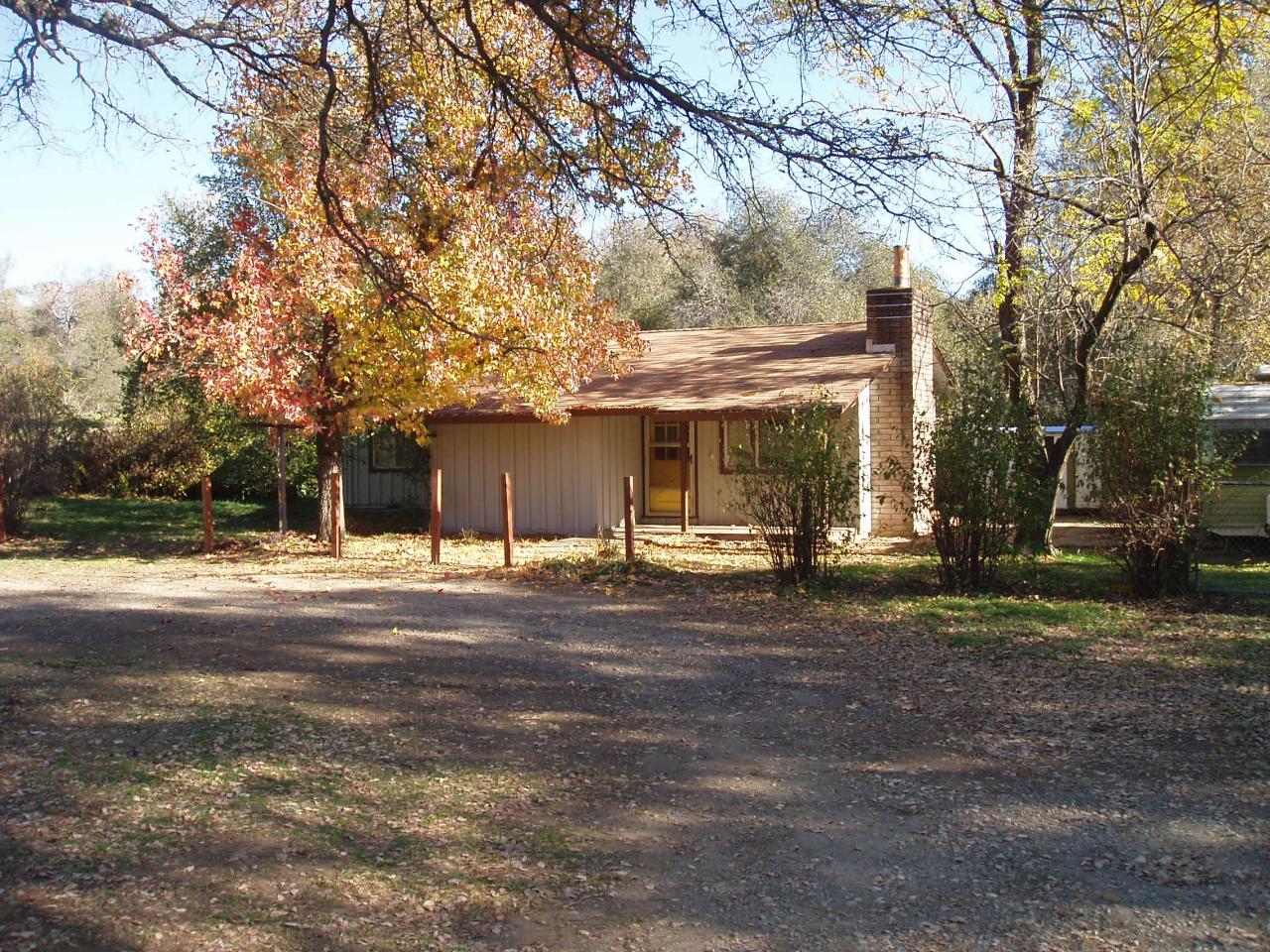 11697 Nash Road Redding, CA 96003 - Photo 1 of 1 a view of a house with a yard and large tree