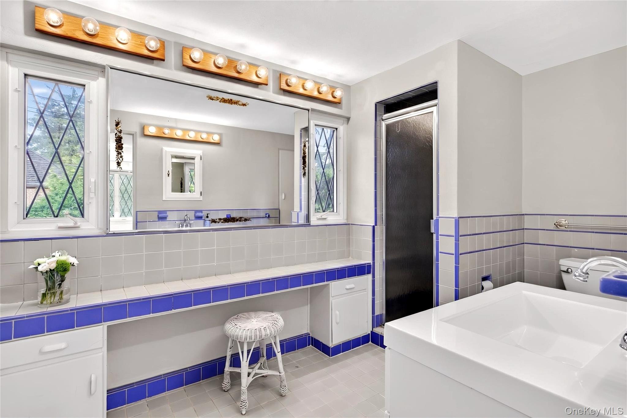 142 Mill Spring Road Manhasset, NY 11030 - Photo 18 of 23 a room with a table and chairs