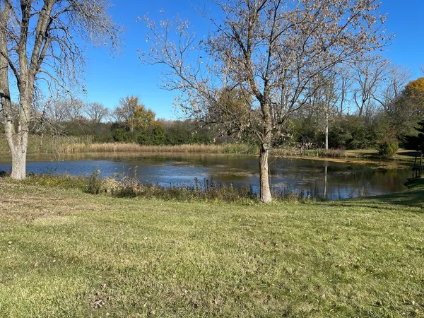 a swimming pool with wooden fence